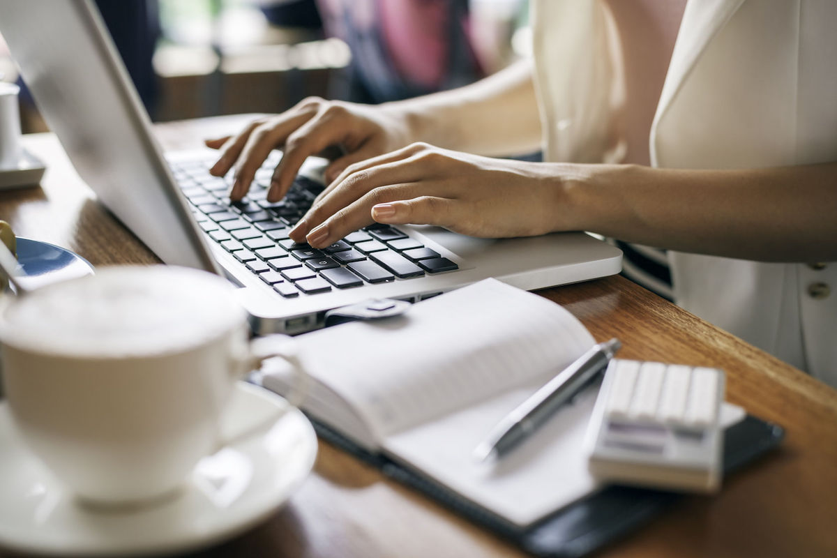 43281795 - journalist typing document in a coffee shop