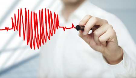 businessman drawing heart and chart heartbeat