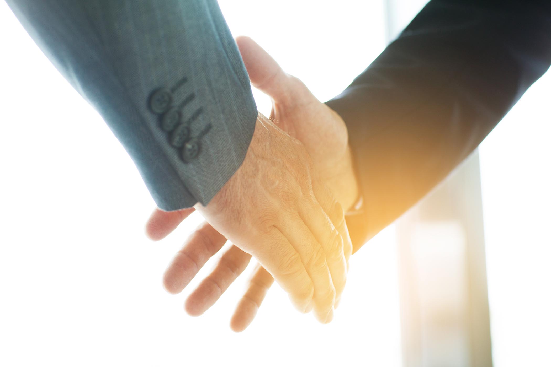 Business people shaking hands, finishing up a meeting