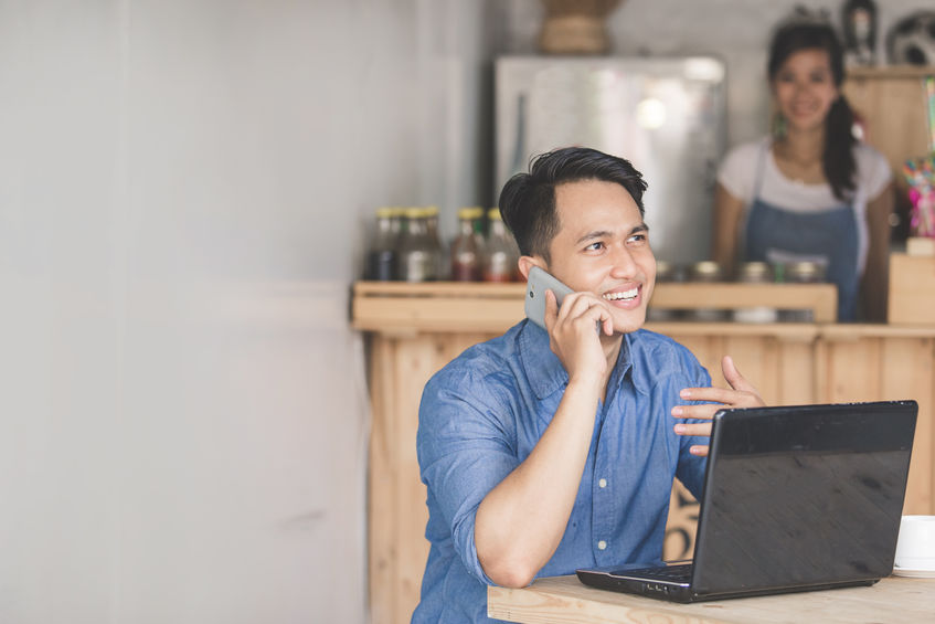 man checking on his paperless open enrollment process 