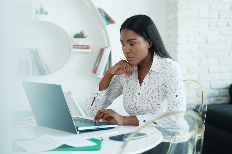 Black Woman Working From Home With Laptop Computer