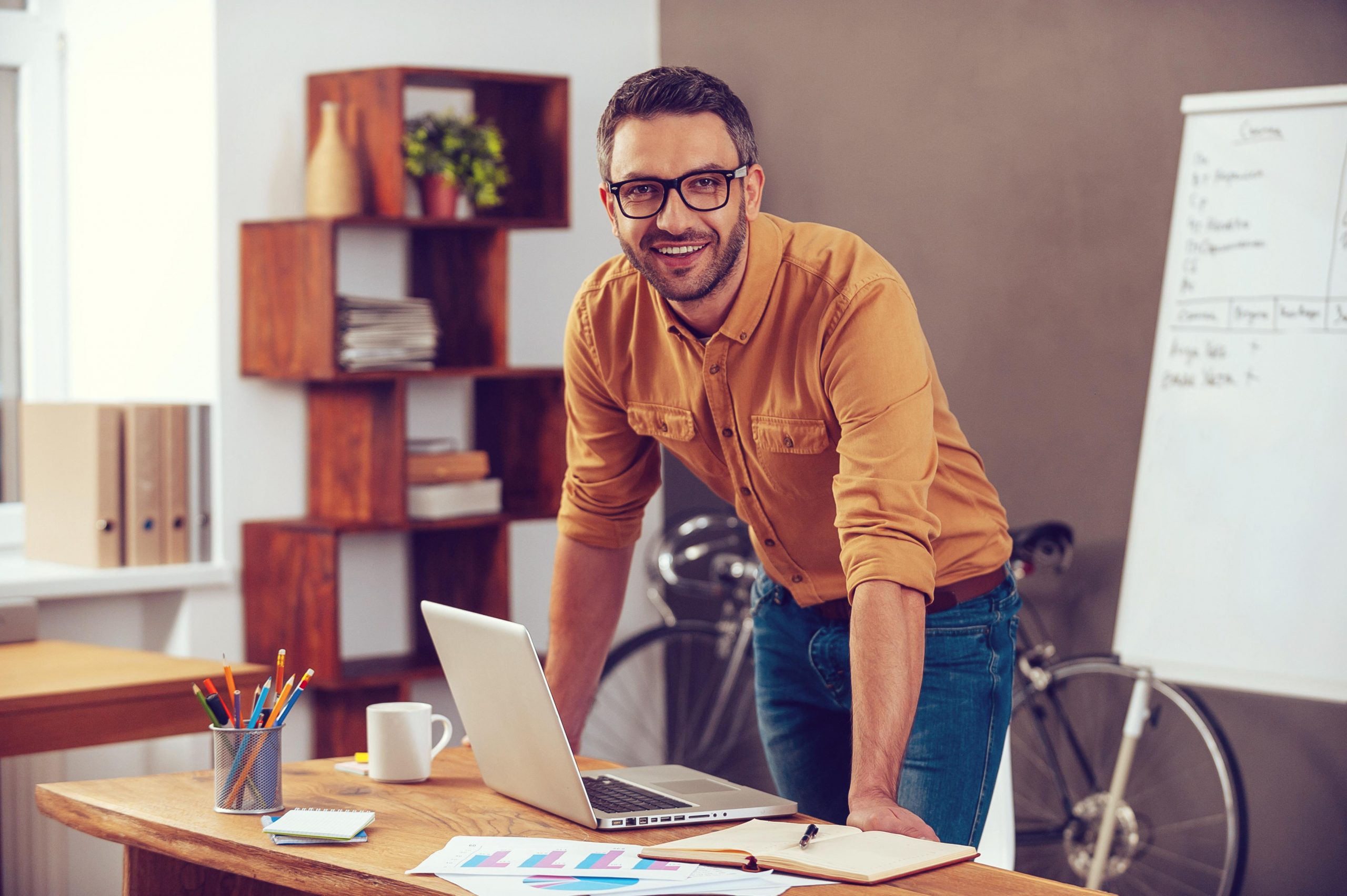 man standing at desk