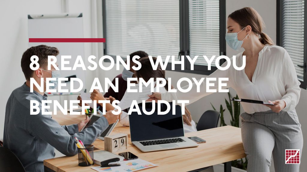 8 Reasons Why you Need An Employee Benefits Audit. Woman in office handing a document to an employee.