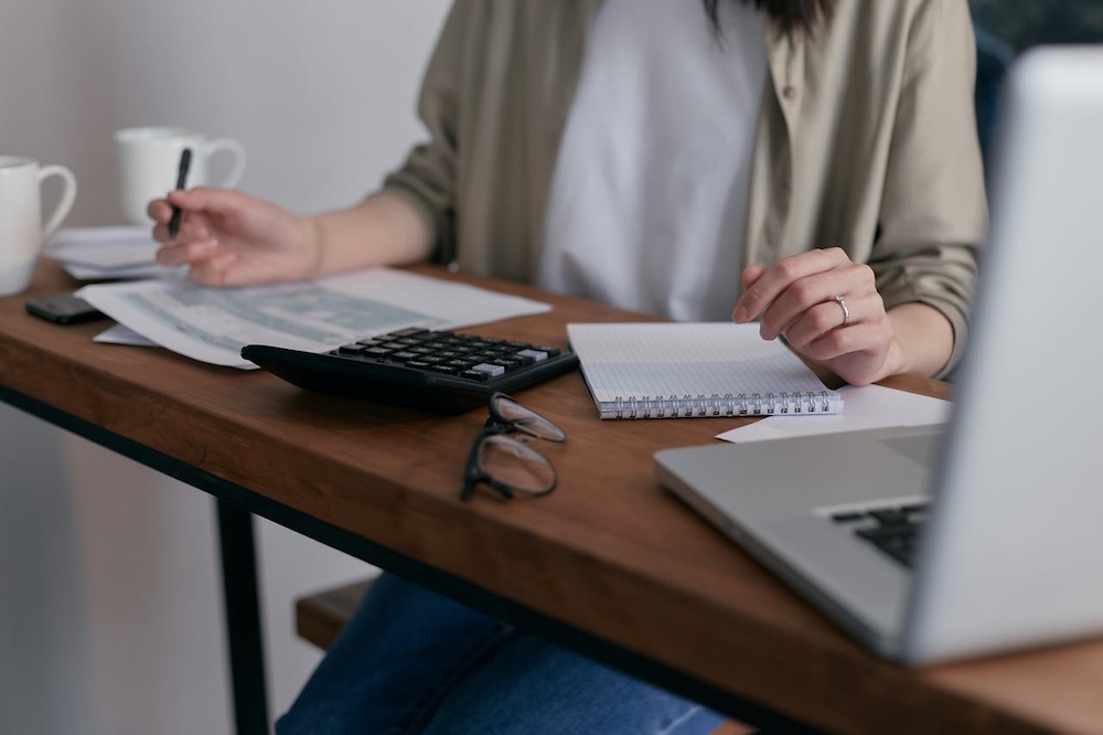 faceless woman reviewing documents
